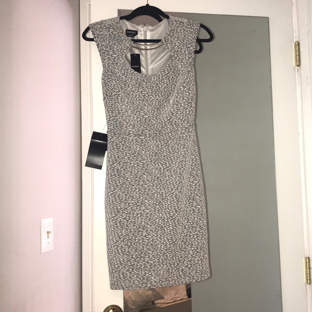 BEBE XS WITH TAGS. NEVER WORN